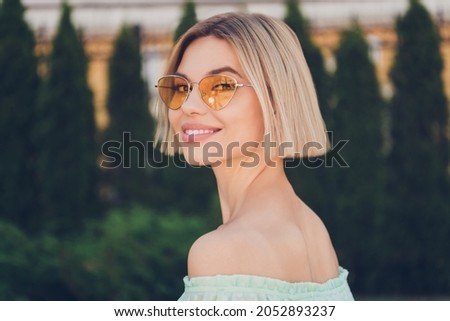 Profile side photo of young attractive girl happy positive smile wear sunglass summer nature outdoors Royalty-Free Stock Photo #2052893237