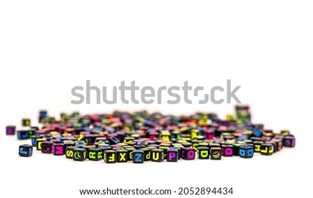 black square beads with letters on white background