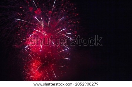 Holiday fireworks backgrounds with sparks, colored stars and bright nebula on black night sky universe, comets. Amazing beauty colorful fireworks display on celebration, showing. Holidays backgrounds