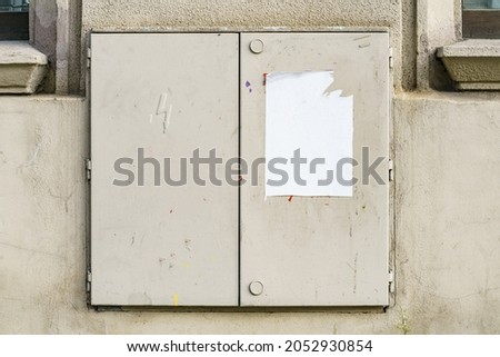 White wrinkled poster template. Glued paper mock up. Blank wheat paste billboard. Empty street art sticker mock up in frame. Clear urban glued advertising canvas. Royalty-Free Stock Photo #2052930854