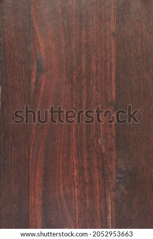 A studio photo of a red jarrah background