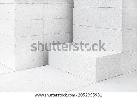 Aerated lightweight gypsum building concrete blocks prepared for building wall modular building house. New Architecture concept Royalty-Free Stock Photo #2052955931