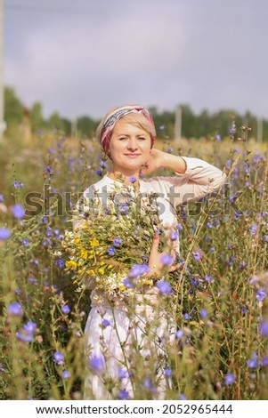 a woman in a field of flowers