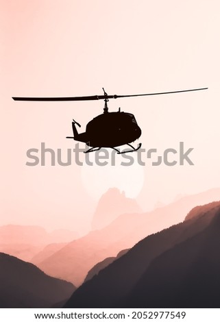 American utility military helicopter in the flight
