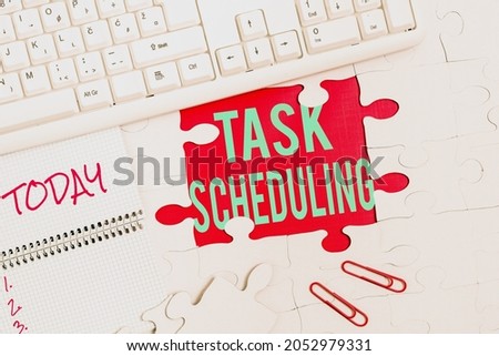 Text sign showing Task Scheduling. Internet Concept The assignment of start and end times to a set of tasks Building An Unfinished White Jigsaw Pattern Puzzle With Missing Last Piece