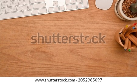 Top view, close-up of Simple  computer desk with copy space for montage your product display on wooden background