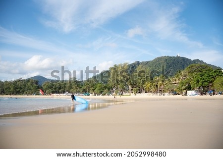 Kata beach Phuket, Thailand famous people relax holiday weekend. Landscape blue sea and sky sand beach during sunset summer.