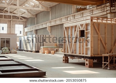 Building under construction with prefabricated containers and cabins Royalty-Free Stock Photo #2053050875