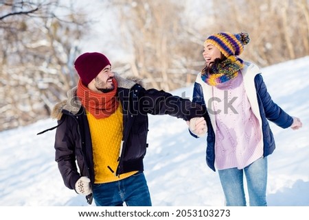 Photo of attractive young couple happy positive smile go walk run park hold hands together weekend vacation romantic