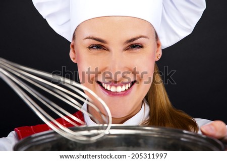 cooking and food concept - smiling female chef with pot and other tools