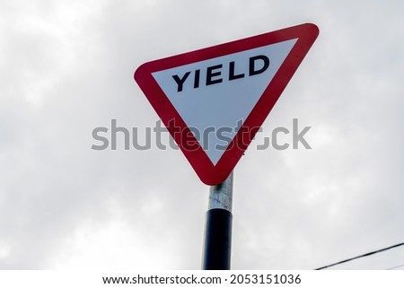 Yield Sign, traffic sign indicating traffic to yield to oncoming traffic at road junction or intersection