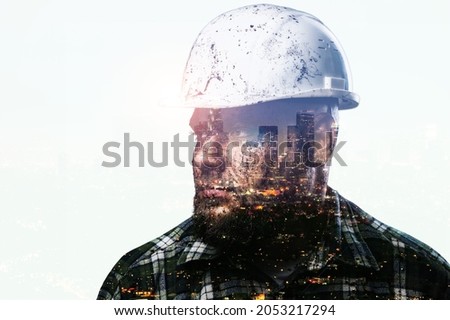 Silhouette of thinking man and modern factory. Double exposure with city.