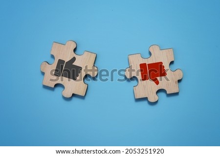 Like and dislike or good and not good emoticon over a blue background. Business concept image