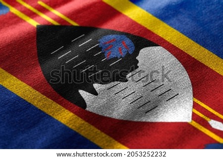 Close up waving flag of Swaziland. Concept of Eswatini.