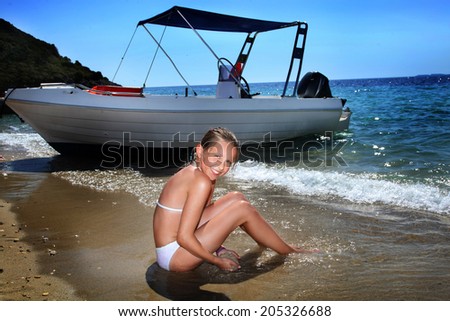 Young girl relaxing on beach, summer photo, Greece