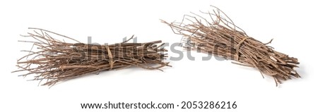 bundle of firewood, pieces of collected small dry tree branches or twigs, isolated in white background, different angle view Royalty-Free Stock Photo #2053286216