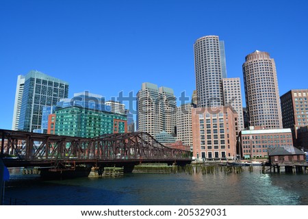Boston skyline and Northern Avenue Bridge along Boston Harbor.