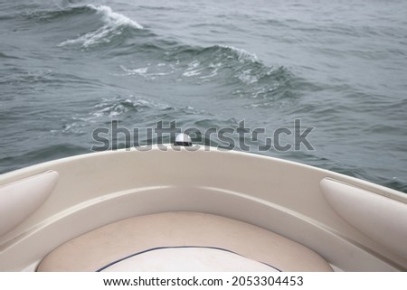 Front of the boat with water background. Water waves in the ocean. Part of the boat.