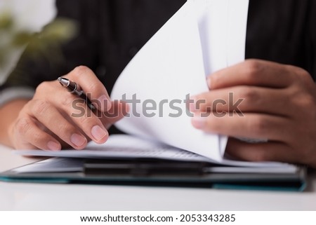 Begin learning for In meeting room concept, document report business note. Businessman manager hands writing at corporate on office desk for reading, signing in paperwork or documentation files. Royalty-Free Stock Photo #2053343285