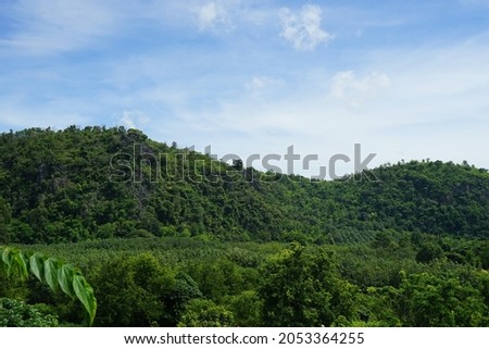 
picture of mountains with greenery with the grass and the sky