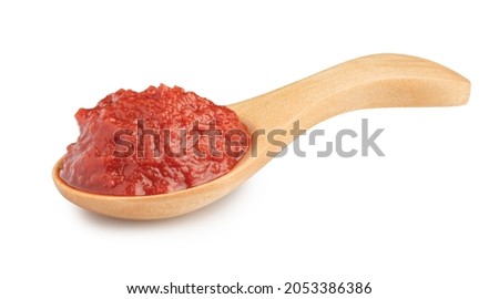 natural tomato paste in wooden spoon isolated on white. Royalty-Free Stock Photo #2053386386