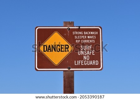 Danger sign isolated on blue sky