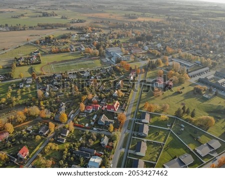 Drone images of Raasiku village located in Estonia. Aerial photos of new real estate neighborhood. Patterns from above. Urban district in residential area of small normal village in Estonia