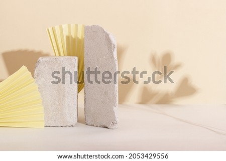 Background with geometric shapes made of concrete for cosmetic products. Rectangular podiums with shadows on a beige background. Blank mockup for product packaging presentation
