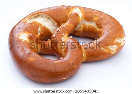 german pretzel with salt isolated on white Royalty-Free Stock Photo #2053433045