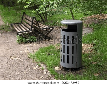 Gray trash can in the park 