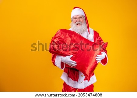 Santa Claus holding a bag full of presents