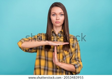 Photo of calm focused concentrated person arm palm show time out symbol isolated on blue color background