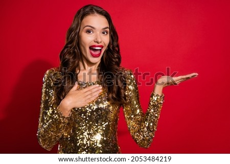 Photo of crazy promoter chic lady hand demonstrate empty space wear golden dress isolated red color background