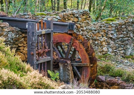 water wheel outside of Sygun Copper Mine, a restored Victorian copper mine in Snowdonia National Park, Wales UK