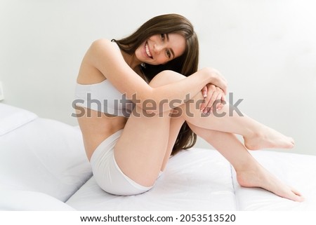 I feel so happy in my skin! Excited woman feeling cheerful and relaxed after doing a laser hair removal at a spa Royalty-Free Stock Photo #2053513520