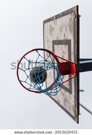 The basketball ball flies into the basket. Sport