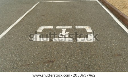 disabled citizens parking sign on the road 