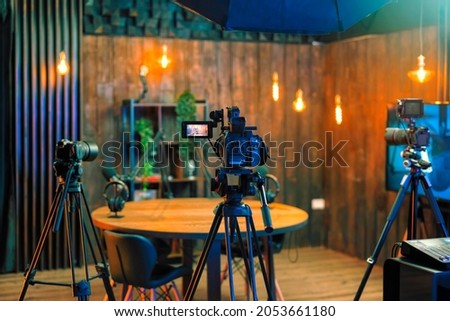 Soundproofing acoustic treatment for home studio recording podcasts for popular videos. Podcast media studio for broadcasting audio. Video camera setup for podcasting microphone speech or interview Royalty-Free Stock Photo #2053661180