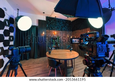 Podcast studio with soundproofing for youtube channels starting to make podcasts for most popular videos. Podcast media studio for broadcasting audio. Podcasting microphone speech or interview. Royalty-Free Stock Photo #2053661195