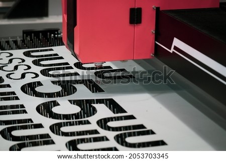 CNC laser cutting metal sheet.Modern industrial technology.