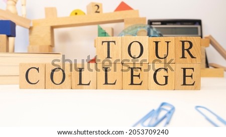 The word college tour was created from wooden cubes. close up