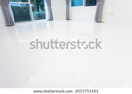 White tile floor with grid line of square texture pattern in perspective. Clean shiny of ceramic surface. Modern interior home design for bathroom, kitchen and laundry room. Empty space for background Royalty-Free Stock Photo #2053755101