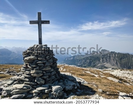 Summit cross on the Silberen mountain in the canton of Uri above the Pragelpass. Beautiful hiking and ski touring region