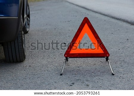 An emergency stop sign for a vehicle is installed on the road. Copy space.