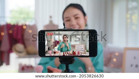 Asia woman micro influencer record live viral video camera at home studio. Happy youtuber fun talk speak advice review hobby in media. Vlogger selfie shoot enjoy work show smile teach like share app. Royalty-Free Stock Photo #2053826630