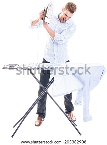 Young man completely overwhelmed with his laundry and the electric iron - isolated on white background