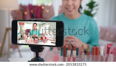 Asia woman micro influencer record live viral video camera at home studio. Happy youtuber fun talk speak advice review hobby in media. Vlogger selfie shoot enjoy work show smile teach like share app. Royalty-Free Stock Photo #2053833275