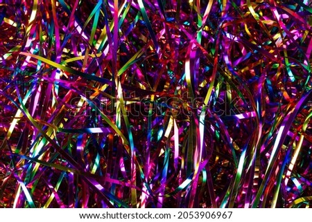 Background multicolored shiny tinsel.Festive background. Royalty-Free Stock Photo #2053906967
