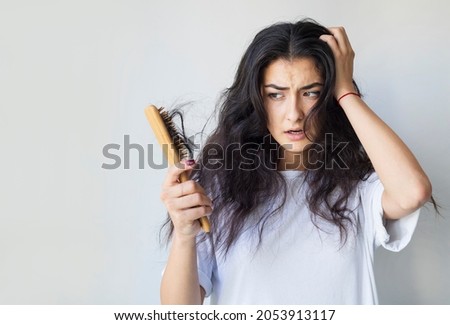 Woman have damaged and broken hair, loss hair, dry problem concept. Royalty-Free Stock Photo #2053913117