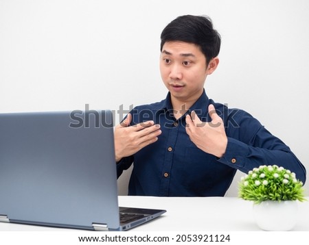 Man gesture explain his work online with laptop on the table white background